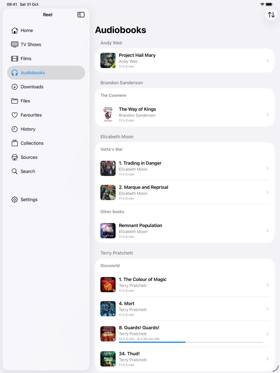 Audiobooks grouped by author and series, with covers and progress